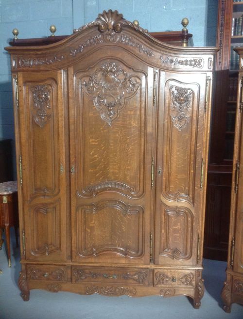 STUNNING PAIR OF FRENCH CARVED OAK ARMOIRES - ADDITIONAL PHOTO 1