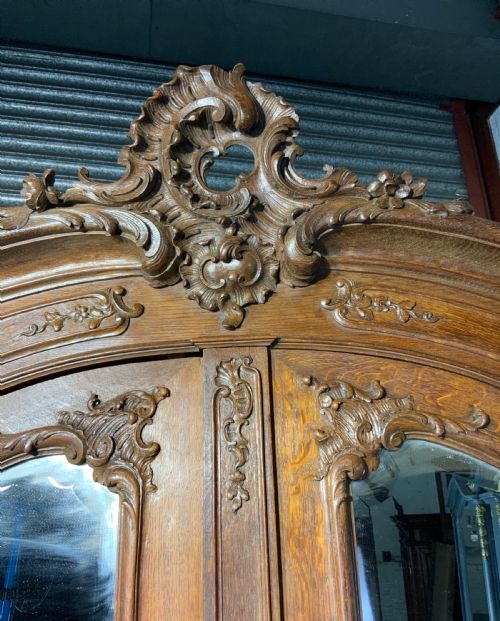 STUNNING PAIR OF FRENCH CARVED OAK ARMOIRES - ADDITIONAL PHOTO 12