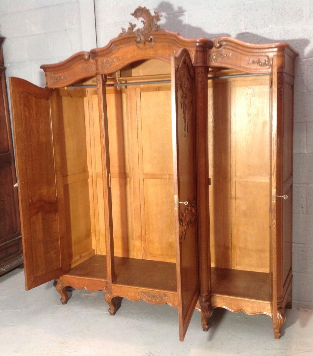 CARVED OAK TRIPLE FRENCH BREAKFRONT ARMOIRE View X