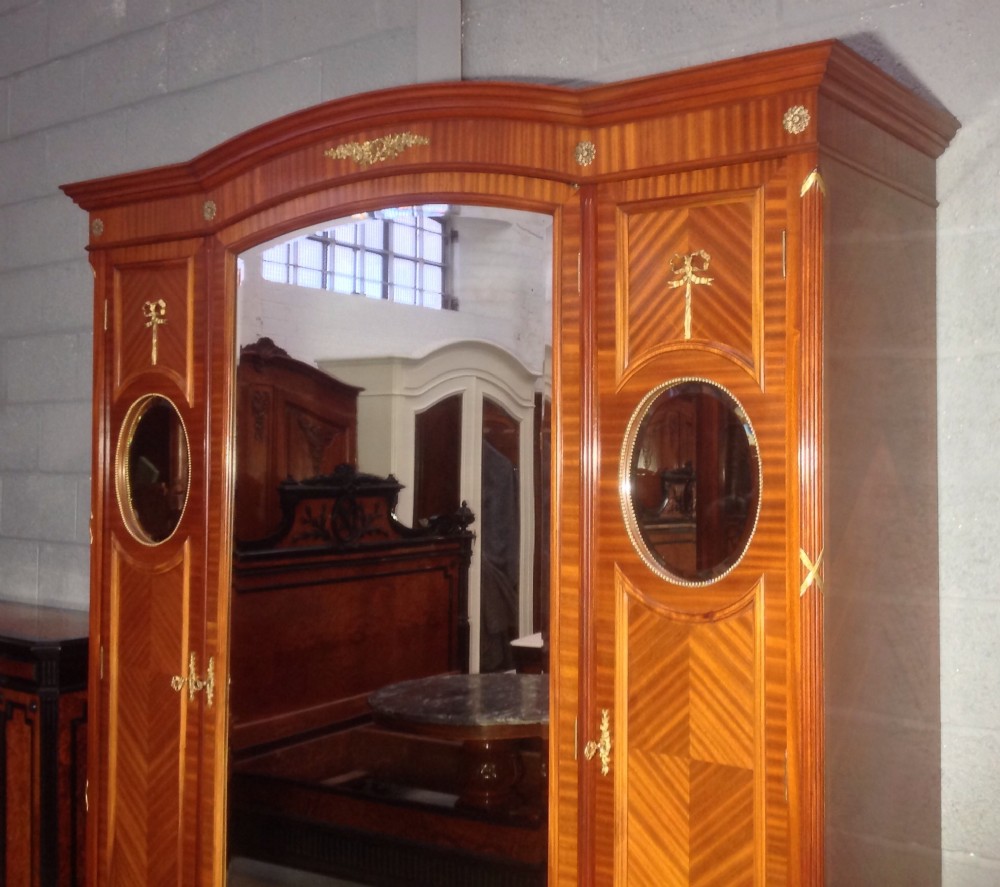 MAHOGANY AND BRASS FRENCH TRIPLE ARMOIRE. View X