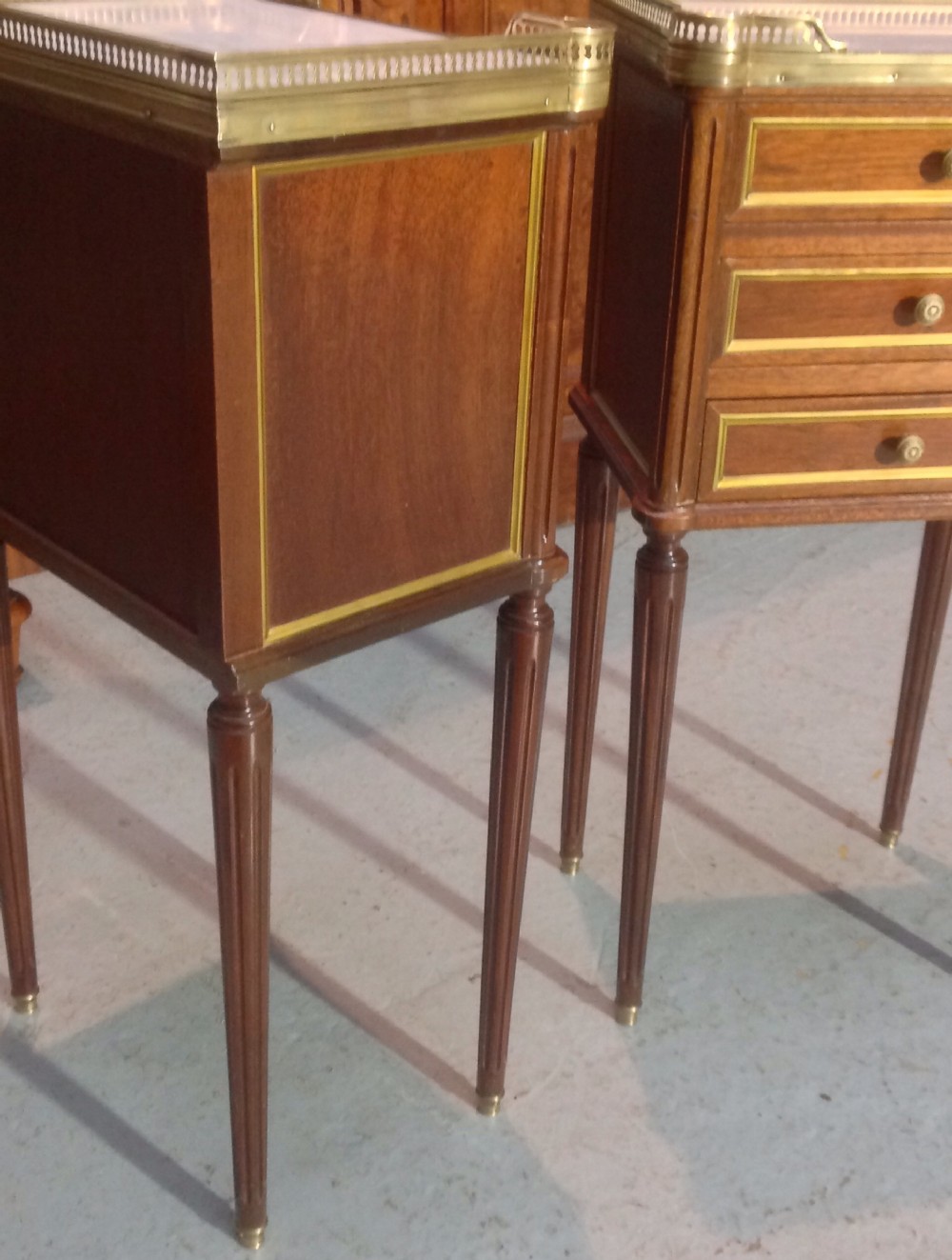 PAIR OF FRENCH MAHOGANY AND BRASS BEDSIDE CABINETS. View V
