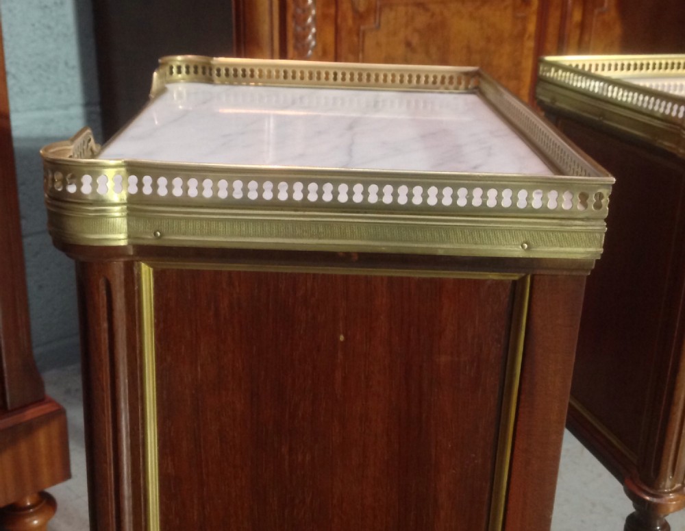 PAIR OF FRENCH MAHOGANY AND BRASS BEDSIDE CABINETS. View VI
