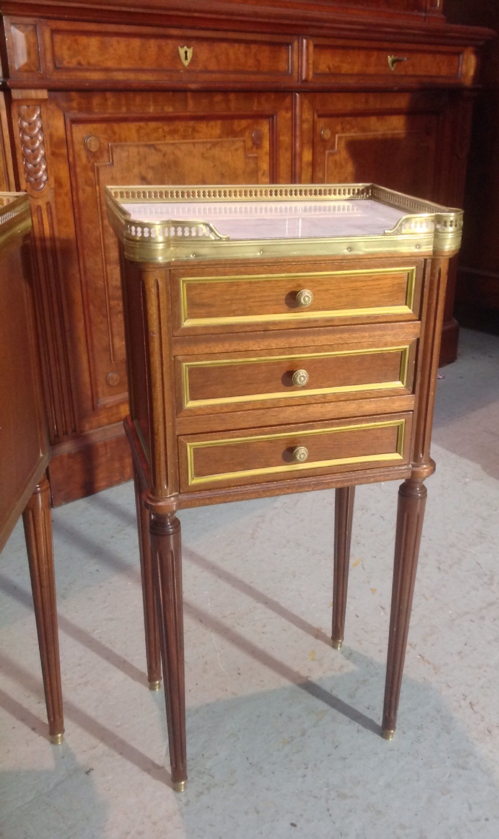 PAIR OF FRENCH MAHOGANY AND BRASS BEDSIDE CABINETS. View VII