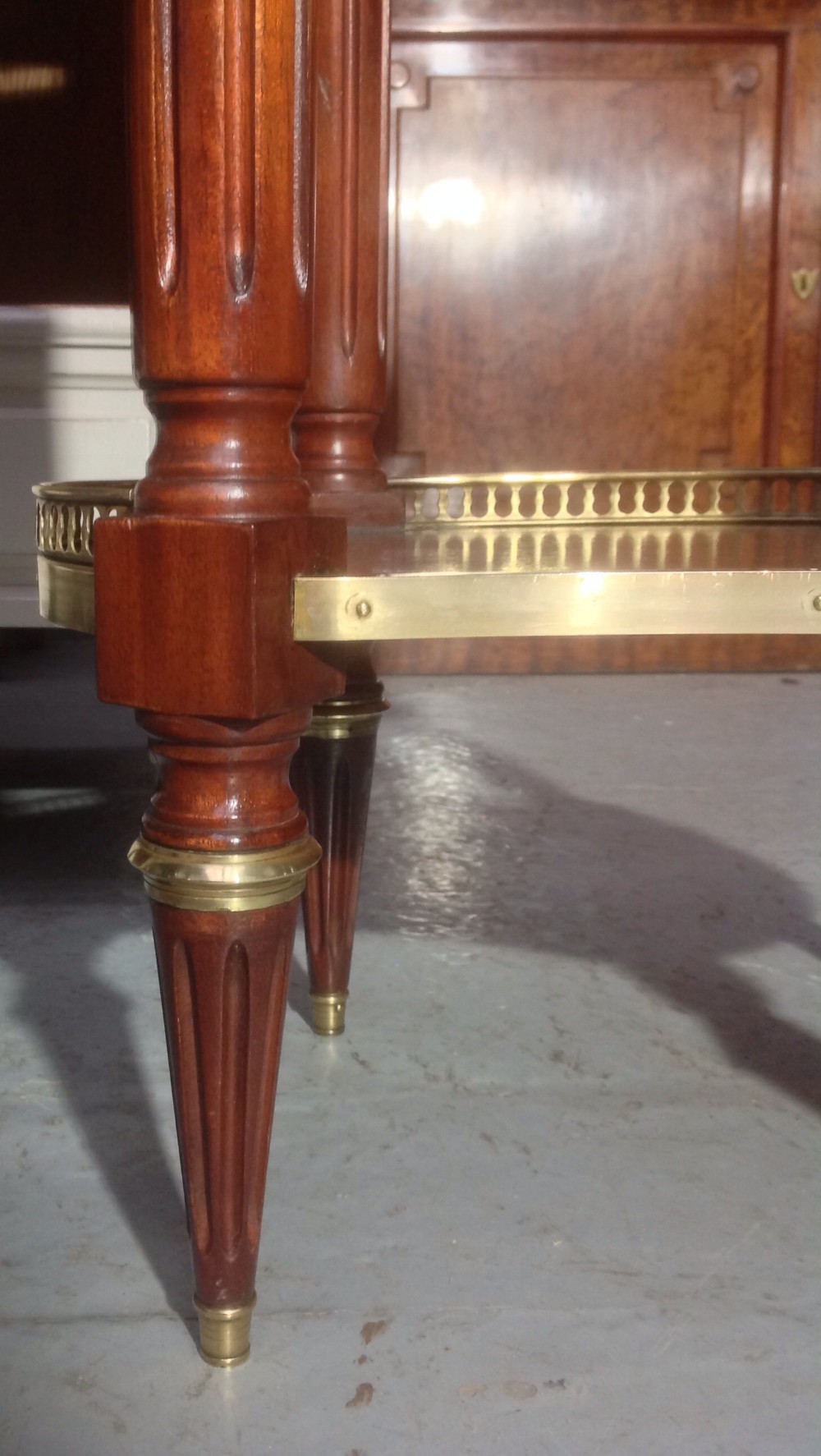 PAIR OF FRENCH MAHOGANY AND BRASS BEDSIDE CABINETS View III