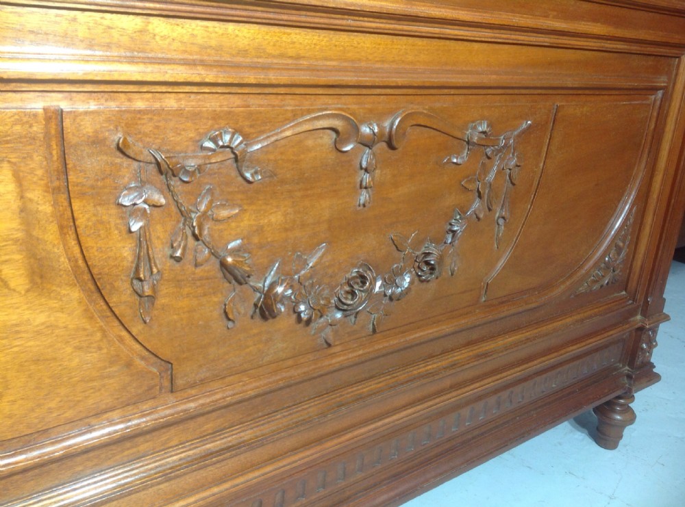 CARVED WALNUT FRENCH BED WITH BRASS DETAILING. View II