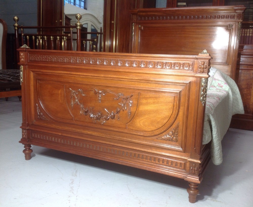 CARVED WALNUT FRENCH BED WITH BRASS DETAILING. View VI