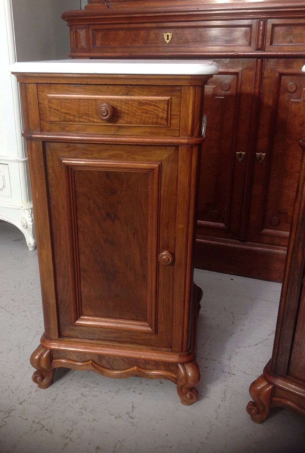 PAIR OF FRENCH WALNUT BEDSIDE CABINETS View II