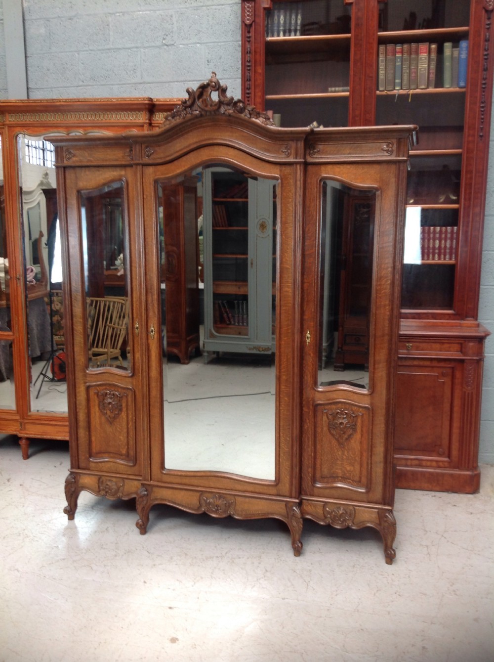 LARGE BREAKFRONT OAK FRENCH TRIPLE DOOR ARMOIRE