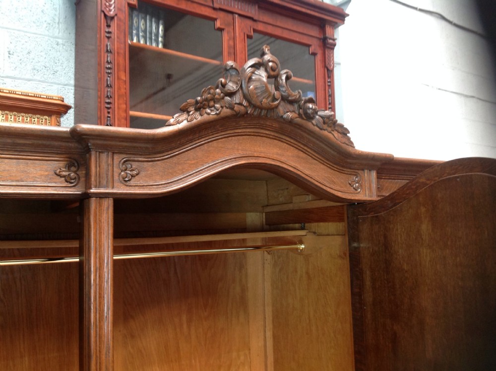 LARGE BREAKFRONT OAK FRENCH TRIPLE DOOR ARMOIRE View V