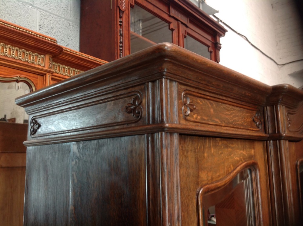 LARGE BREAKFRONT OAK FRENCH TRIPLE DOOR ARMOIRE View X