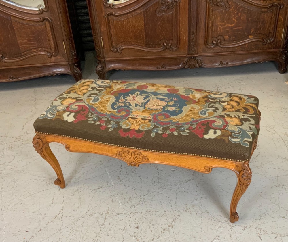 LARGE ORNATELY CARVED OAK FRENCH STOOL