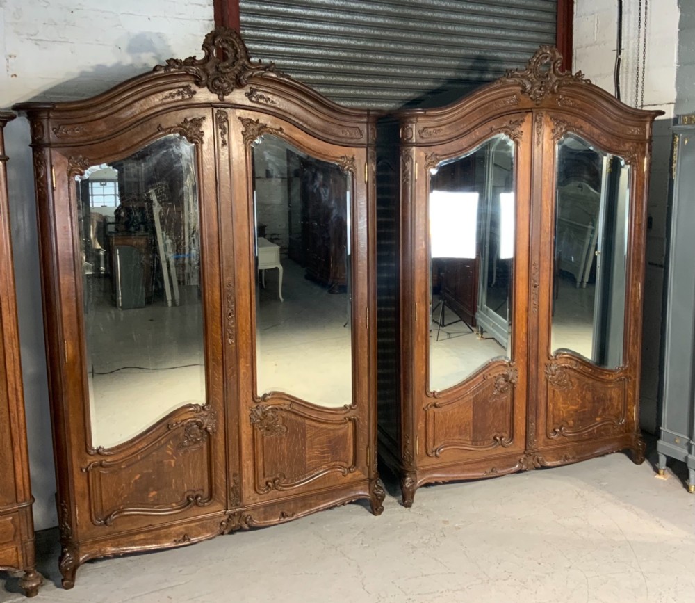 STUNNING PAIR OF FRENCH CARVED OAK ARMOIRES