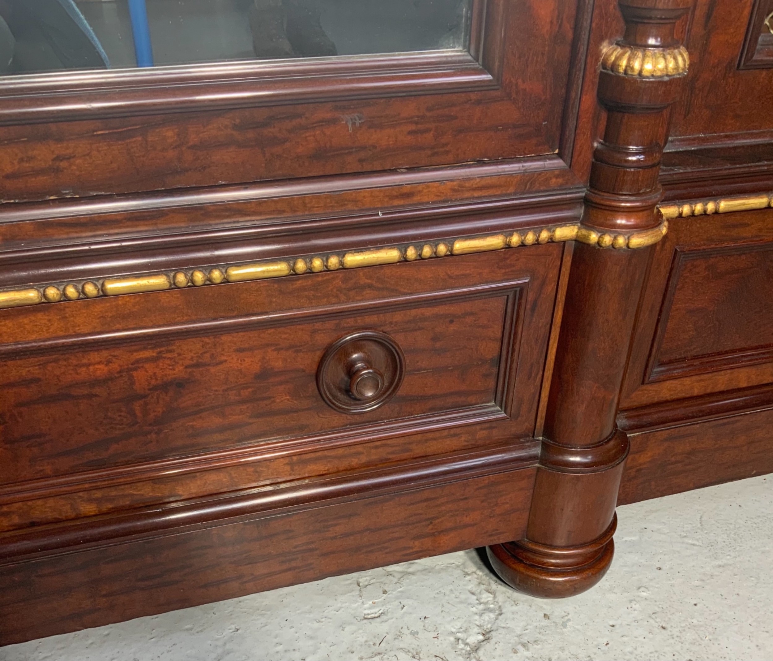 A large mahogany three-door armoire featuring a central arched mirrored door, wire-mesh side panels, and gilt bronze mounts. View XV