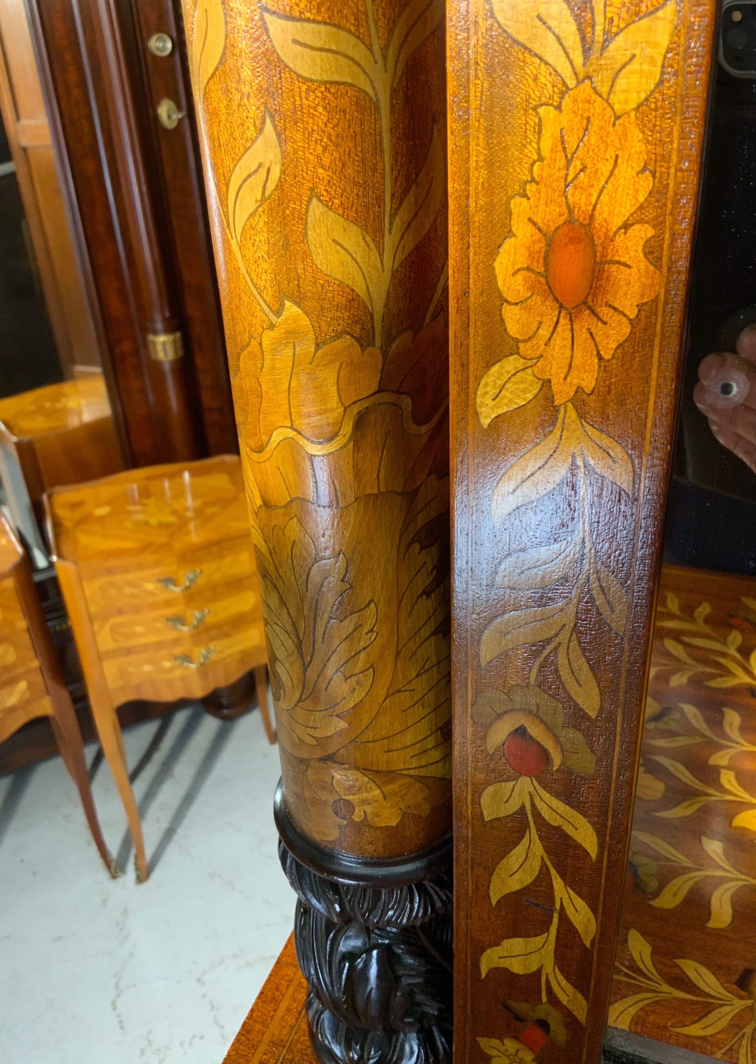 An early nineteenth-century Dutch mahogany dressing chest featuring detailed floral marquetry, three wide drawers, carved pilasters ending in paw feet, and an attached arched mirror. View VIII