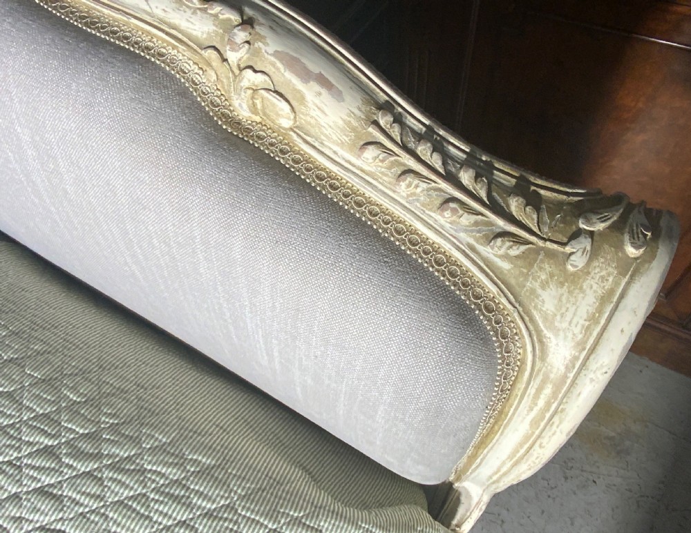 A French provincial style double bed frame featuring a carved off-white painted timber frame, scrolled cabriole legs, and an upholstered headboard. View VII