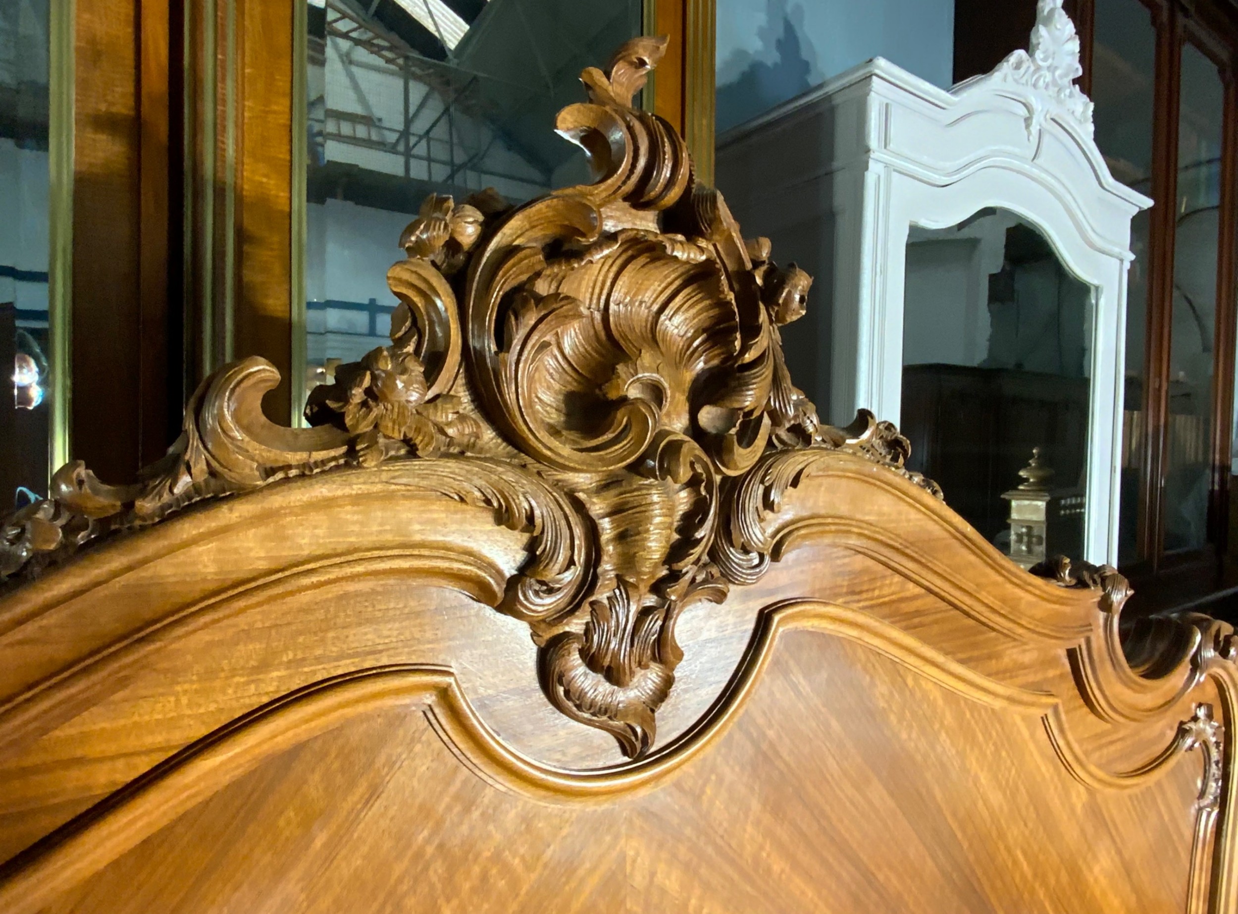 A king size French Louis XV style wooden bed frame featuring a carved crest, parquetry panelwork, and curved legs. View VI