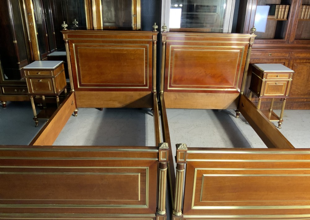 PAIR OF FRENCH MAHOGANY AND BRASS EMPIRE BEDS