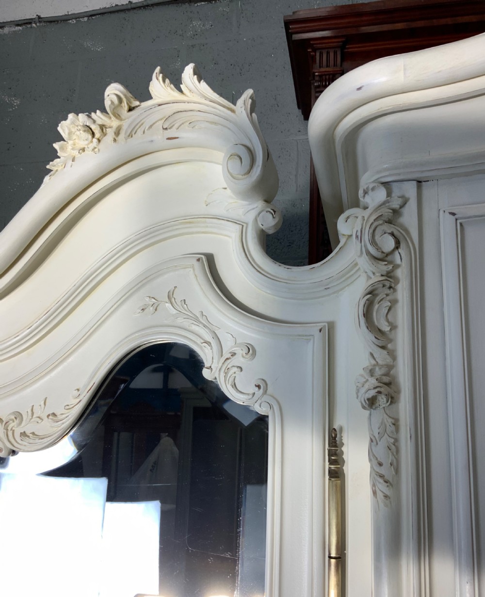 STUNNING OVERSIZED CARVED TRIPLE ARMOIRE  View III