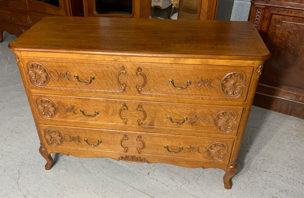 CARVED OAK FRENCH CHEST OF DRAWERS  View II