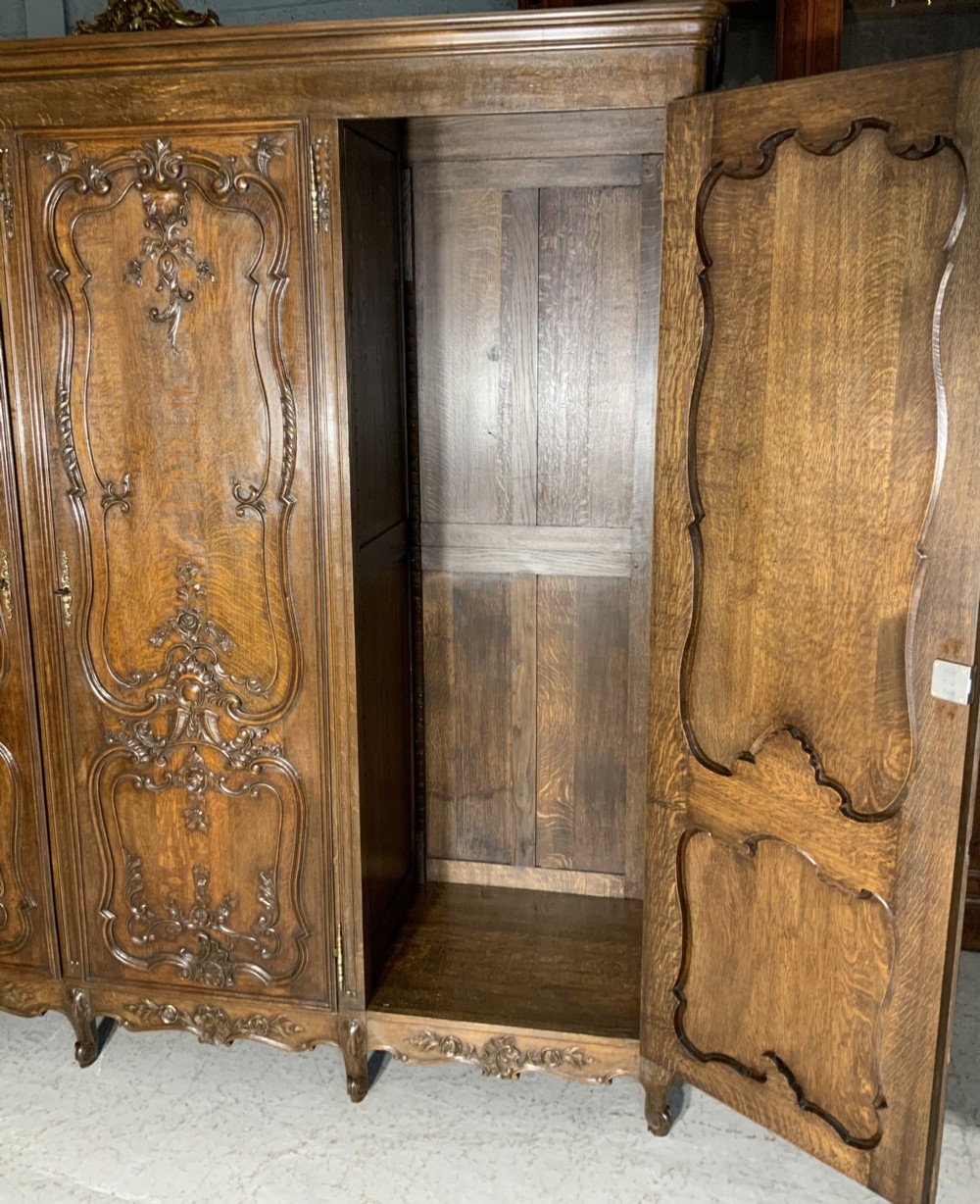 CARVED OAK TRIPLE ARMOIRE  View V