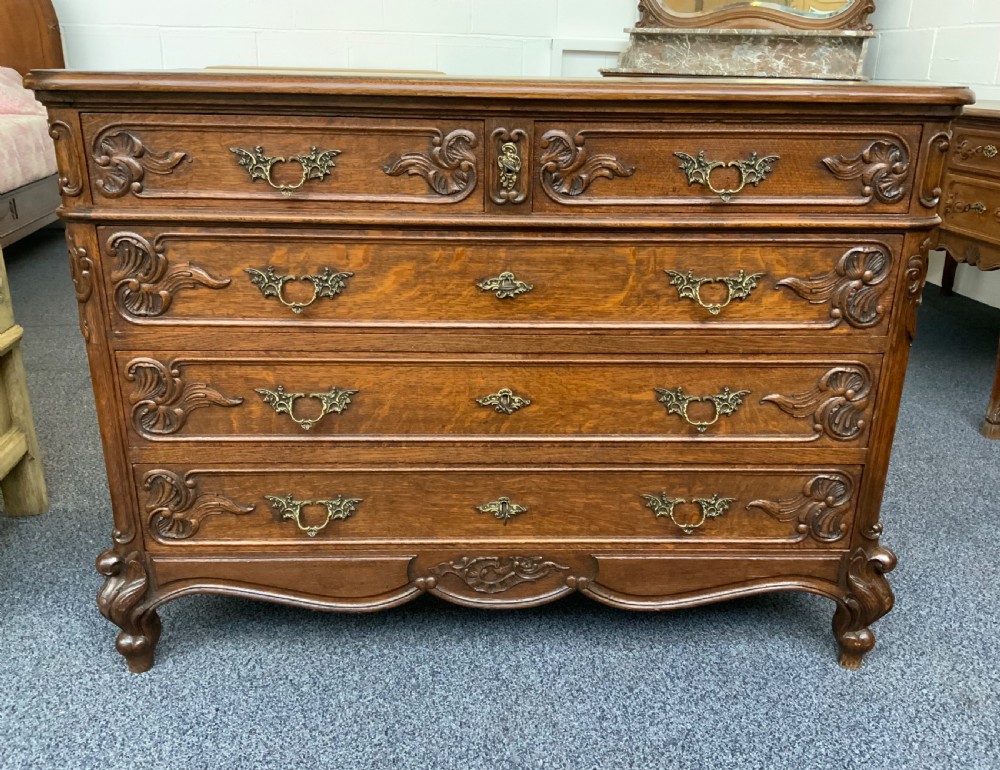 CARVED OAK FRENCH CHEST OF DRAWERS  View II