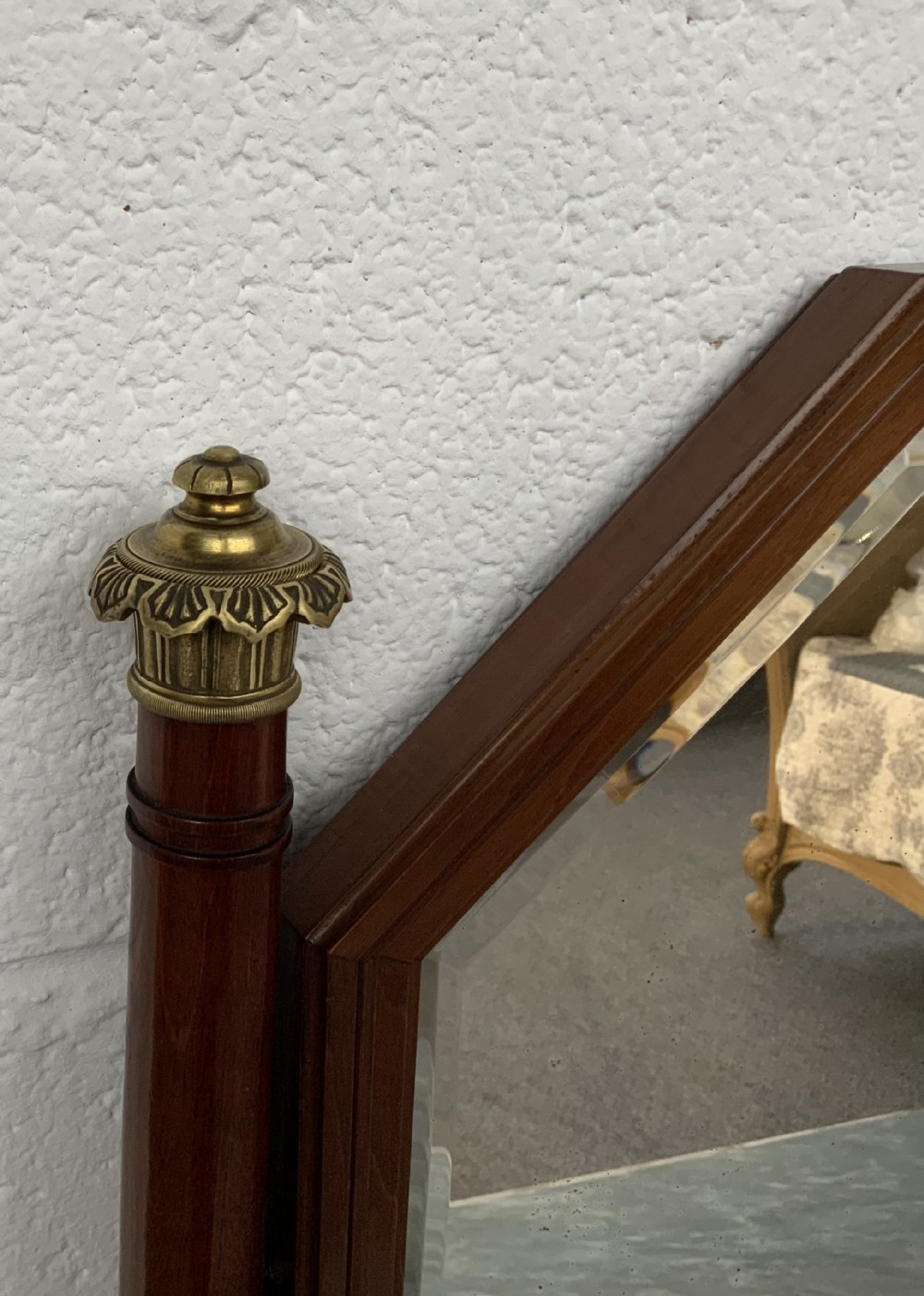 A French mahogany dressing table featuring a grey marble surface, an octagonal mirror flanked by twin brass candle holders, and intricate brass mounts. View III