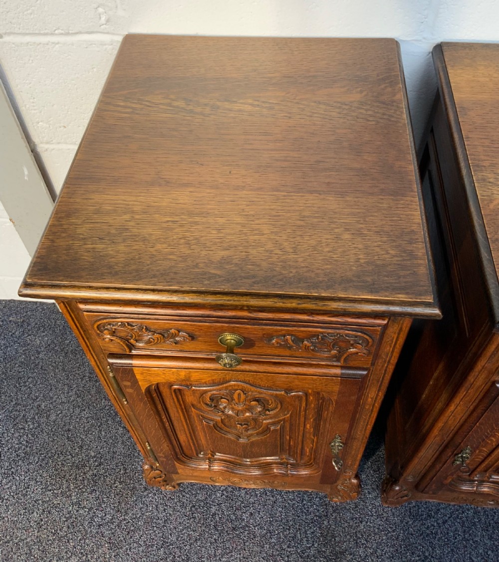 PAIR OF OAK CARVED BEDSIDE CABINETS  View II