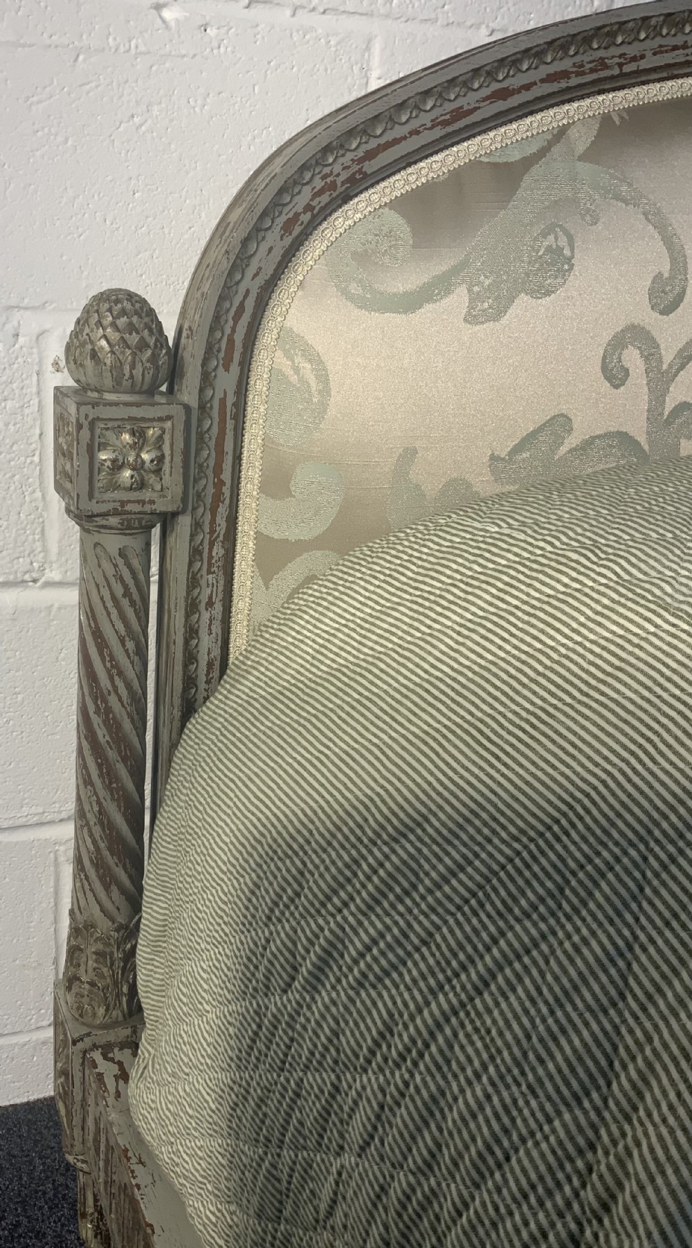 A French Louis XVI style king size bed frame featuring distressed painted grey carved wood with fluted details and newly upholstered damask fabric panels. View V