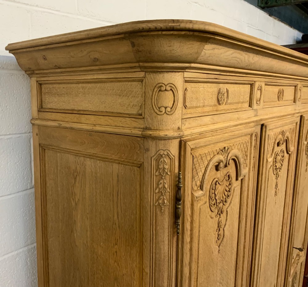 CARVED FRENCH OAK BLEACHED TRIPLE ARMOIRE  View VI