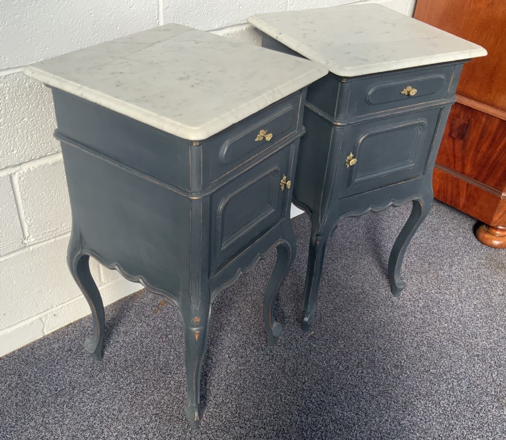 A pair of French bedside cabinets featuring dark grey painted frames, white marble tops, single drawers, cupboard doors, and cabriole legs. View II