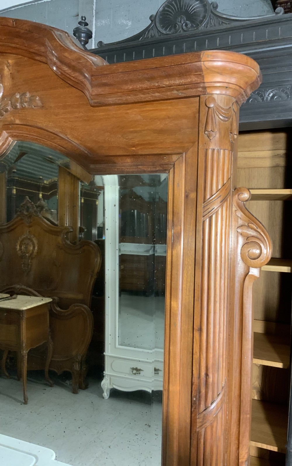 An antique mahogany French washstand featuring a white marble top, integrated arched mirror, multiple drawers, and side cupboards with brass handles. View VIII