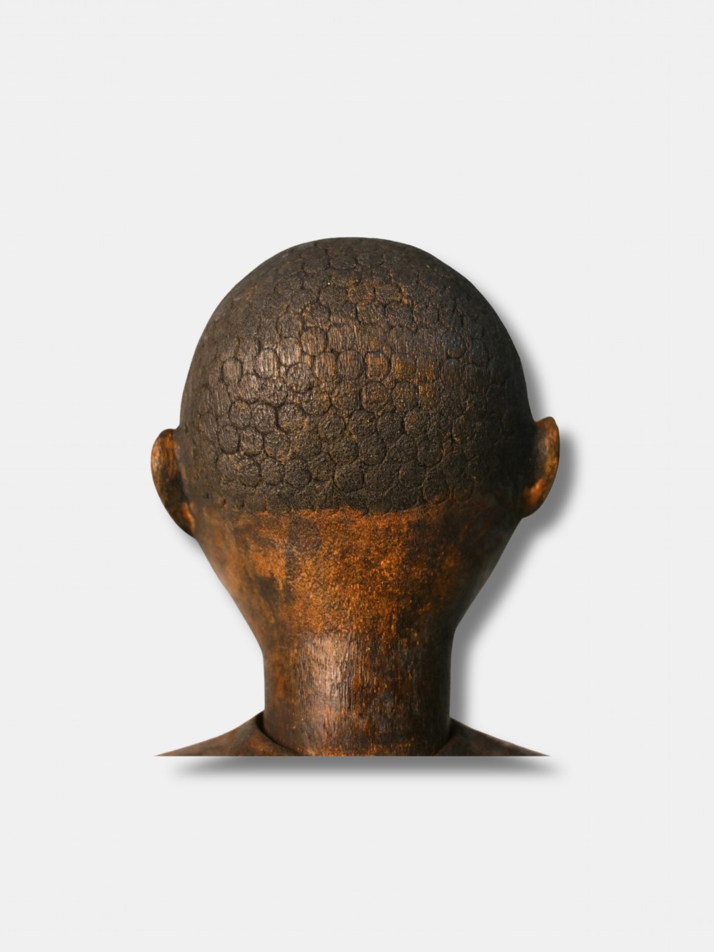 A carved dark wood articulated lay figure standing upright with jointed limbs. View VI
