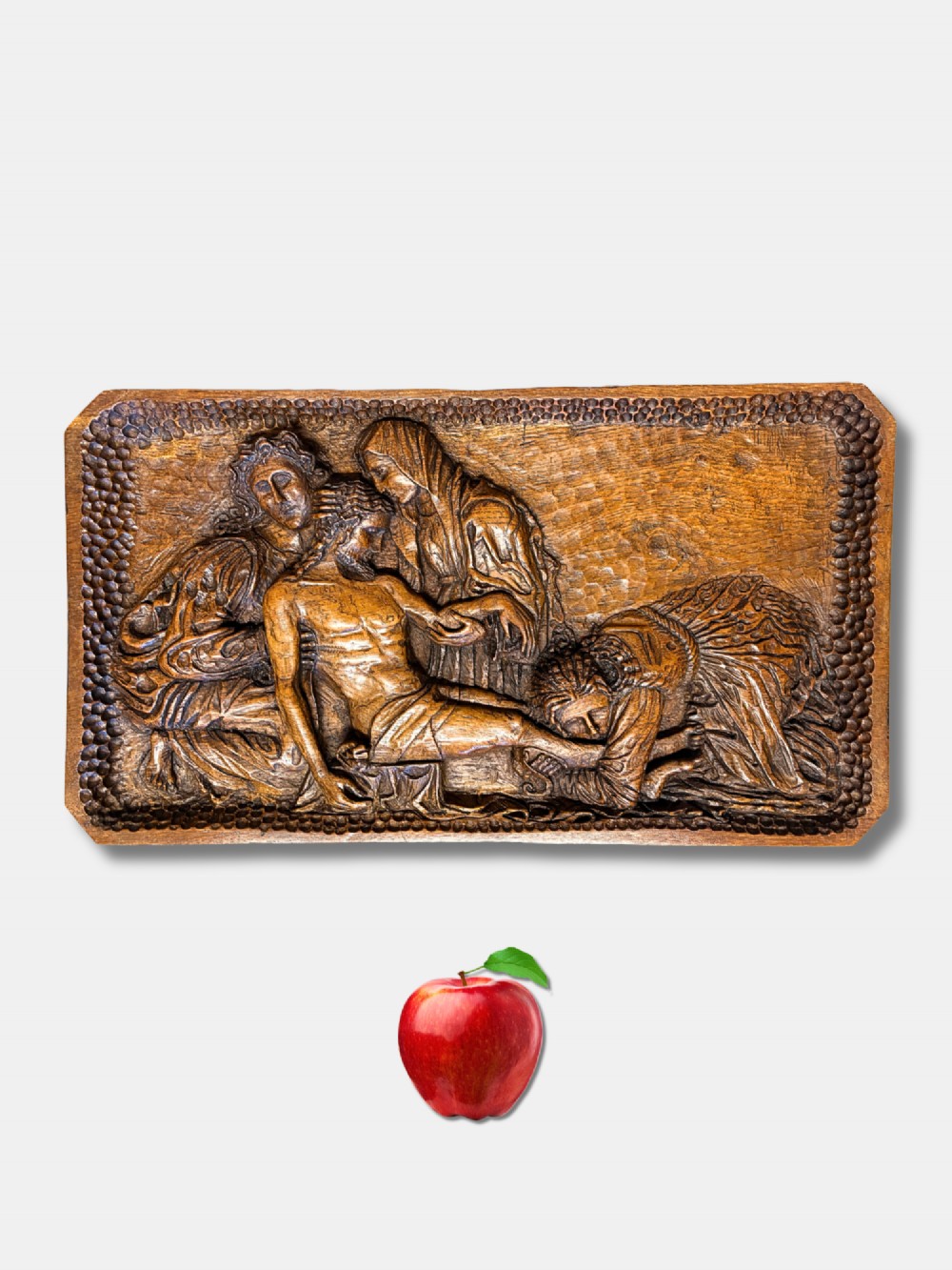 A rectangular hand-carved warm brown chestnut wooden relief panel depicting the biblical Lamentation of Christ surrounded by figures.