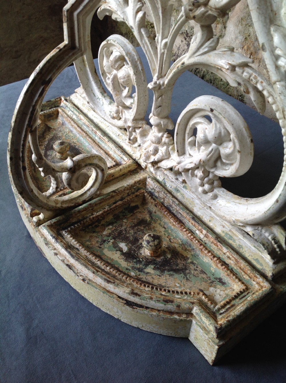 An ornate off-white painted Victorian cast iron umbrella stand with botanical scrollwork and a twin drip tray base. View XI