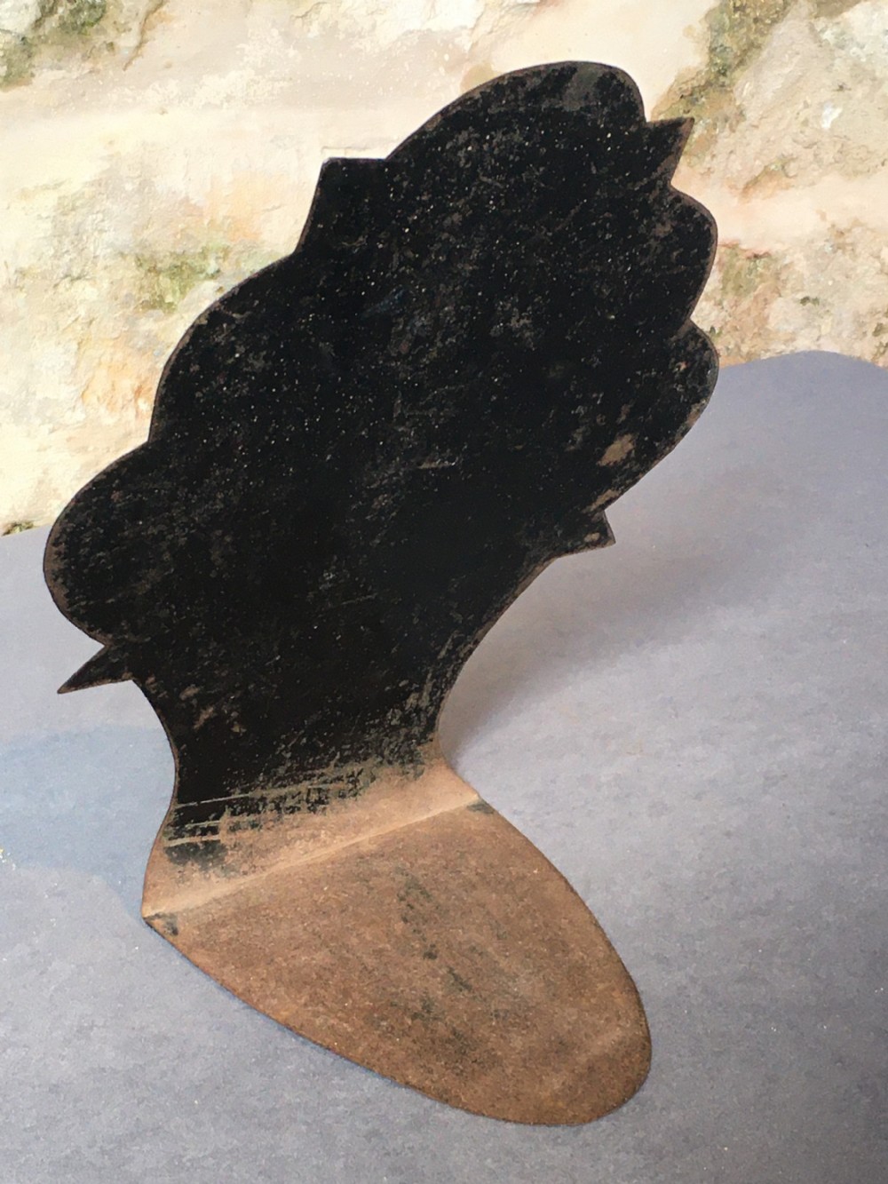 A contoured painted sheet metal stand depicting a botanical floral and fruit still life arrangement. View VII