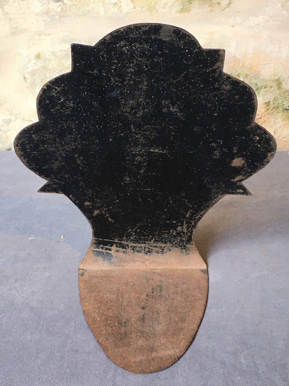 A contoured painted sheet metal stand depicting a botanical floral and fruit still life arrangement. View IX