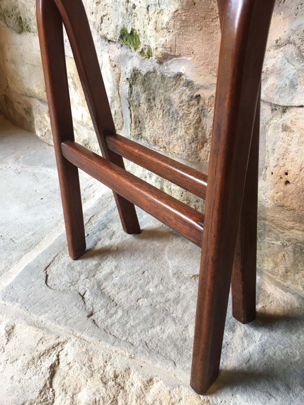 A Victorian mahogany folding occasional table with a hinged circular top supported by curved X-frame legs. View XXII