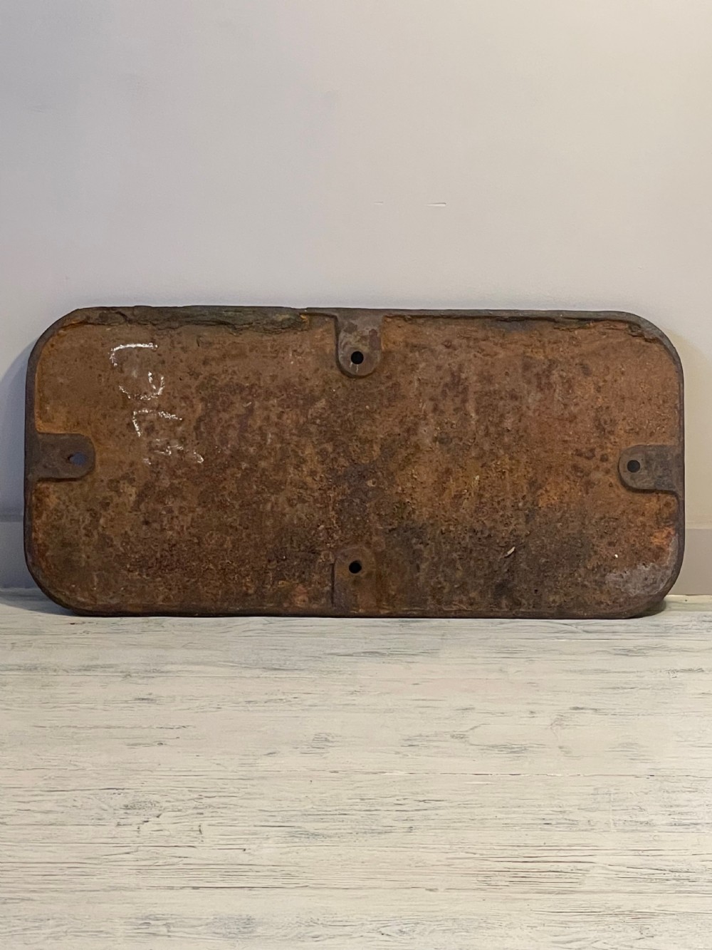 A rectangular cast metal locomotive number plate featuring raised digits 3767 in gold tone against a black background. View X