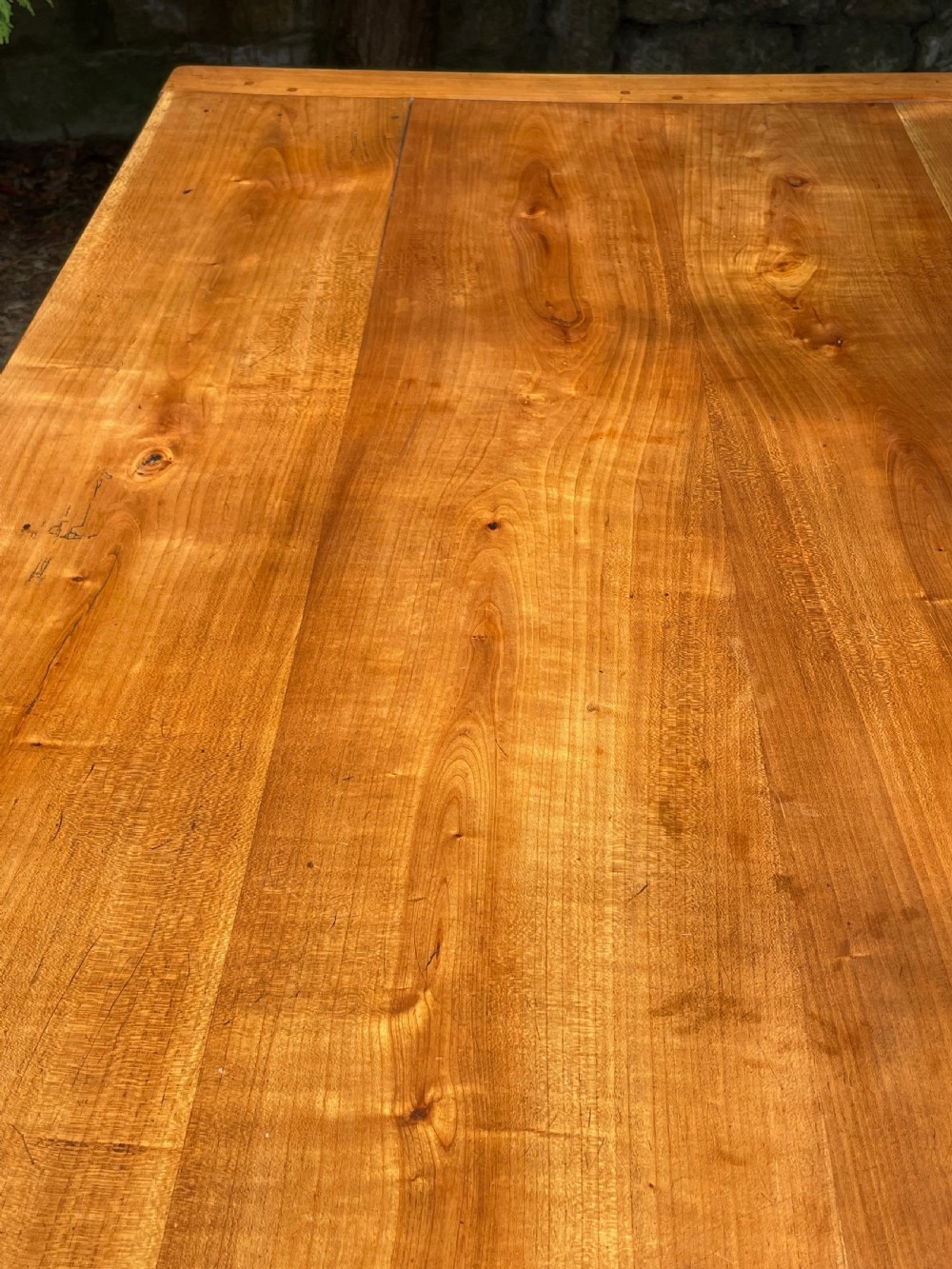 A rectangular wooden refectory dining table with a plank top, breadboard ends, and four tapered legs. View VI