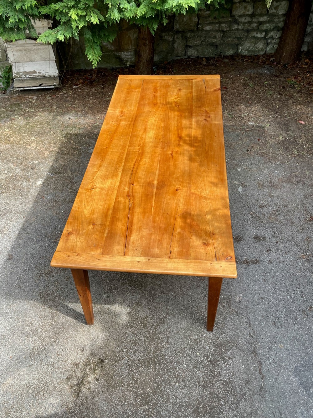 A rectangular wooden refectory dining table with a plank top, breadboard ends, and four tapered legs. View XIII