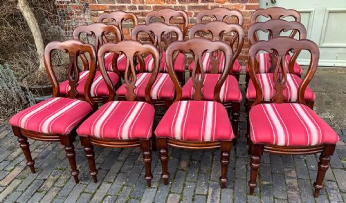 A Set of 12 Victorian Mahogany Spear Point Balloon Back Dining Chairs