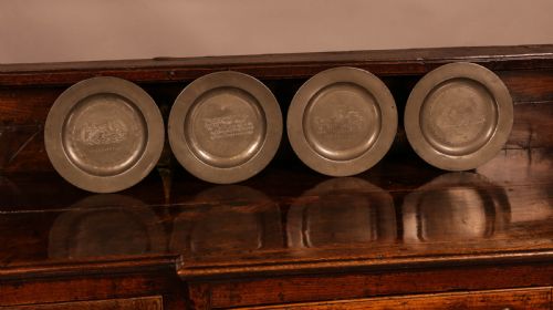 A Set of 4 Pewter Plates with Engraved Decoration