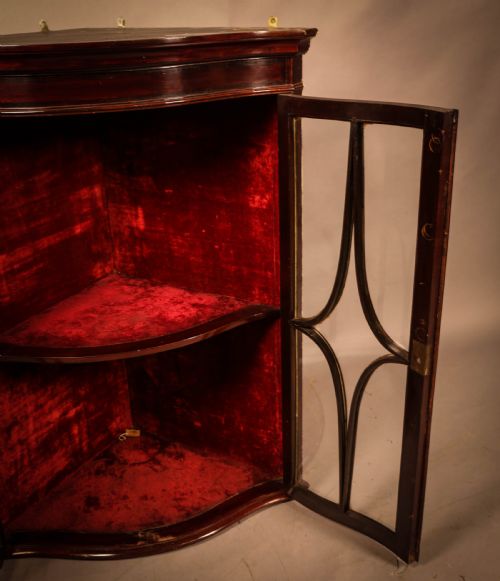 AN UNUSUAL SERPENTINE FRONT CORNER CUPBOARD - ADDITIONAL PHOTO 2