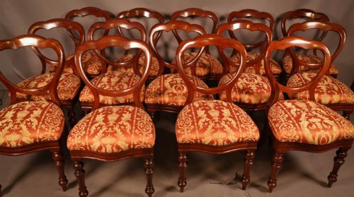 A Rare Set of 16 Victorian Mahogany Balloon Back Dining Chairs