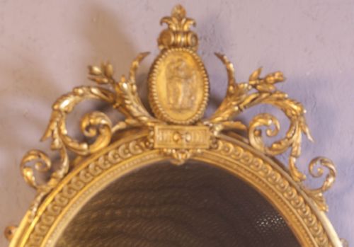 A GEORGIAN OVAL GILT FRAMED MIRROR - ADDITIONAL PHOTO 1
