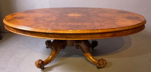 A BURR WALNUT VICTORIAN COFFEE TABLE
