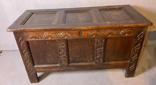 A 17TH CENTURY OAK COFFER CARVED