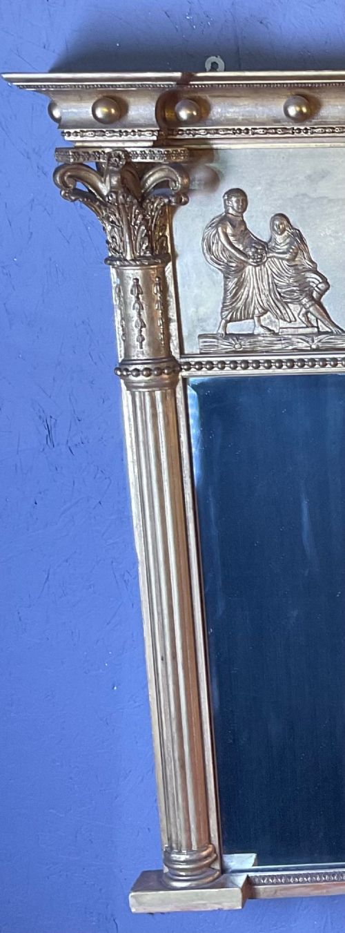 A Victorian gilded gesso overmantel mirror featuring a classical relief frieze above three mirror plates framed by fluted Corinthian columns. View IV