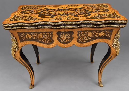 A Stunning Marquetry Games Table Inlaid and Brass Mounts