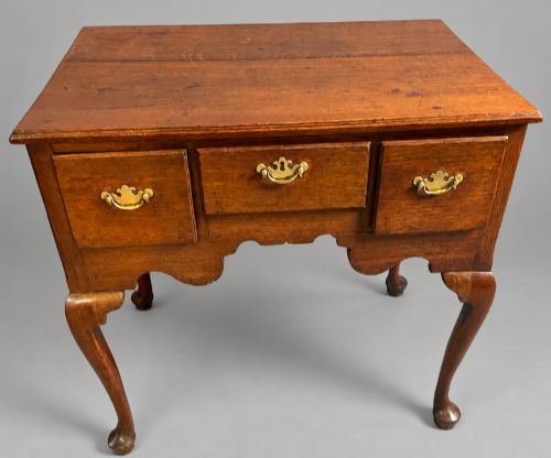 A Georgian oak low boy circa 1750